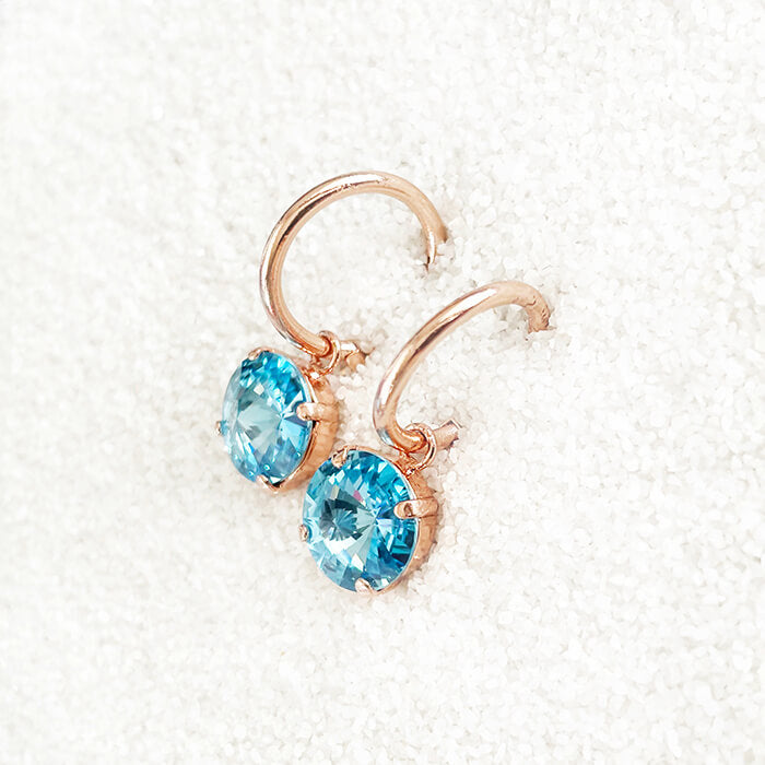Aquamarine Swarovski Earrings set in rose gold at an angle