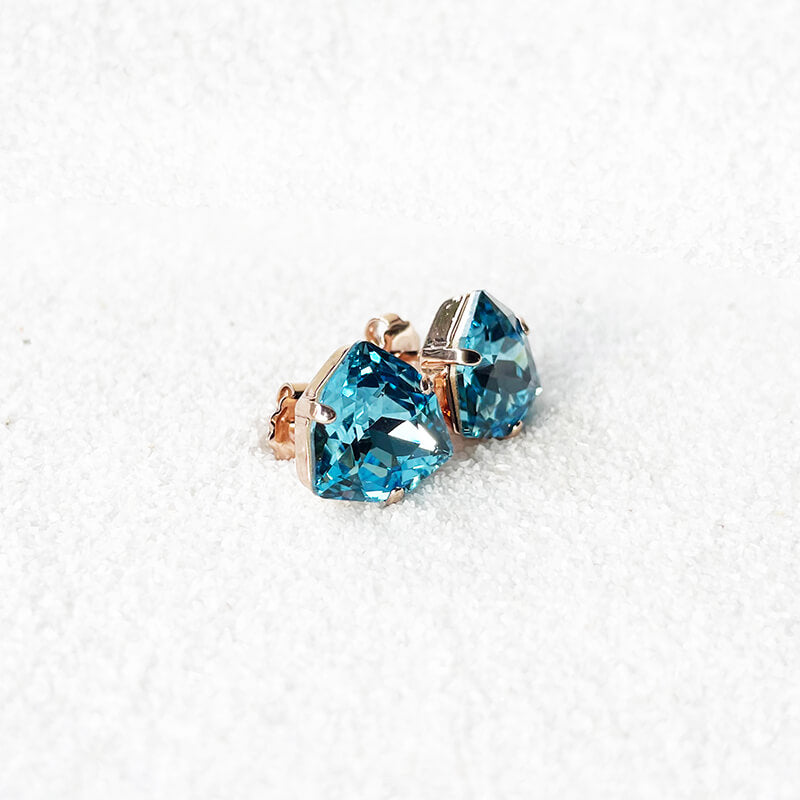 Aquamarine stud earrings with a blue Swarovski set in rose gold side angle 
