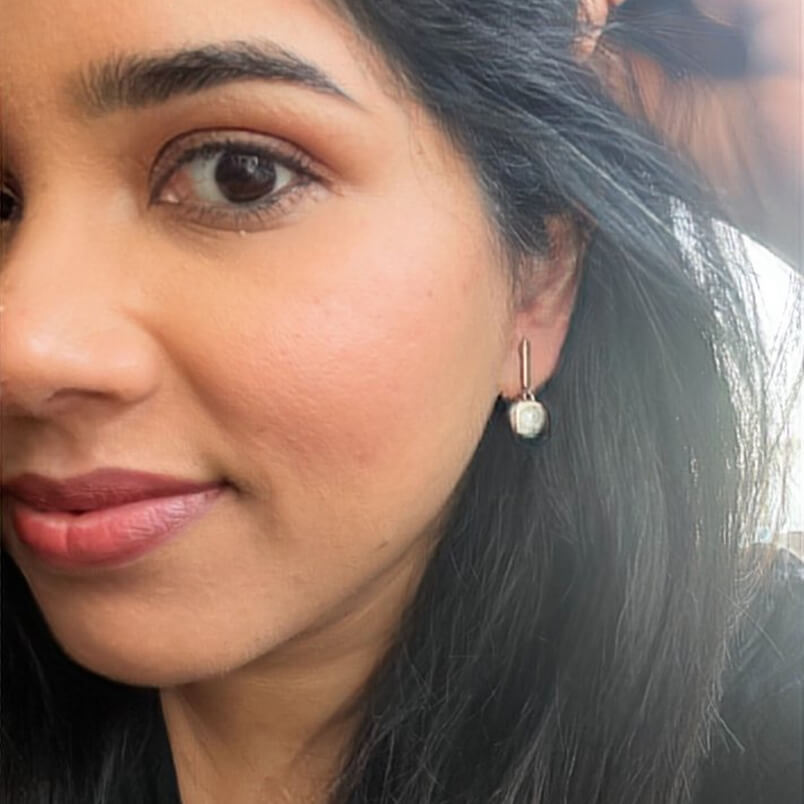 Swarovski drop earrings with rose gold finish on model