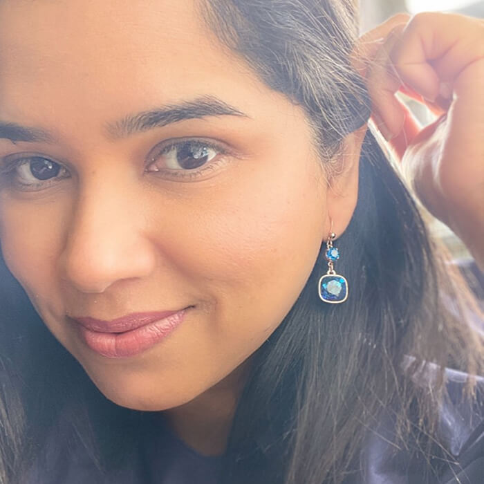 Swarovski dangle earrings on model