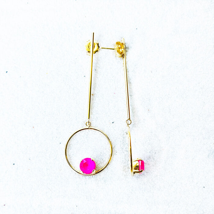gold dangle earrings with hot pink swarovski top view