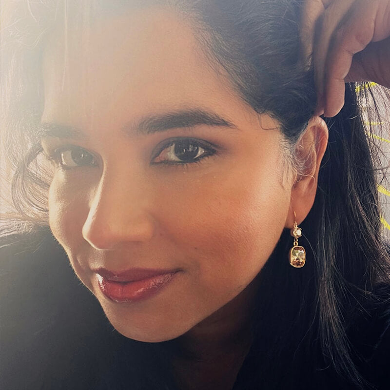 swarovski gold earrings on model