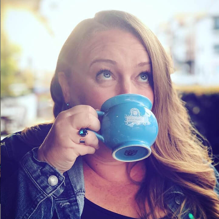 jay crisp crow copywriter wearing sea glam adjustable swarovski ring and rose gold stud earrings