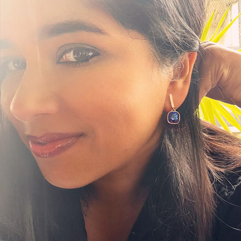 purple Swarovski earrings on model