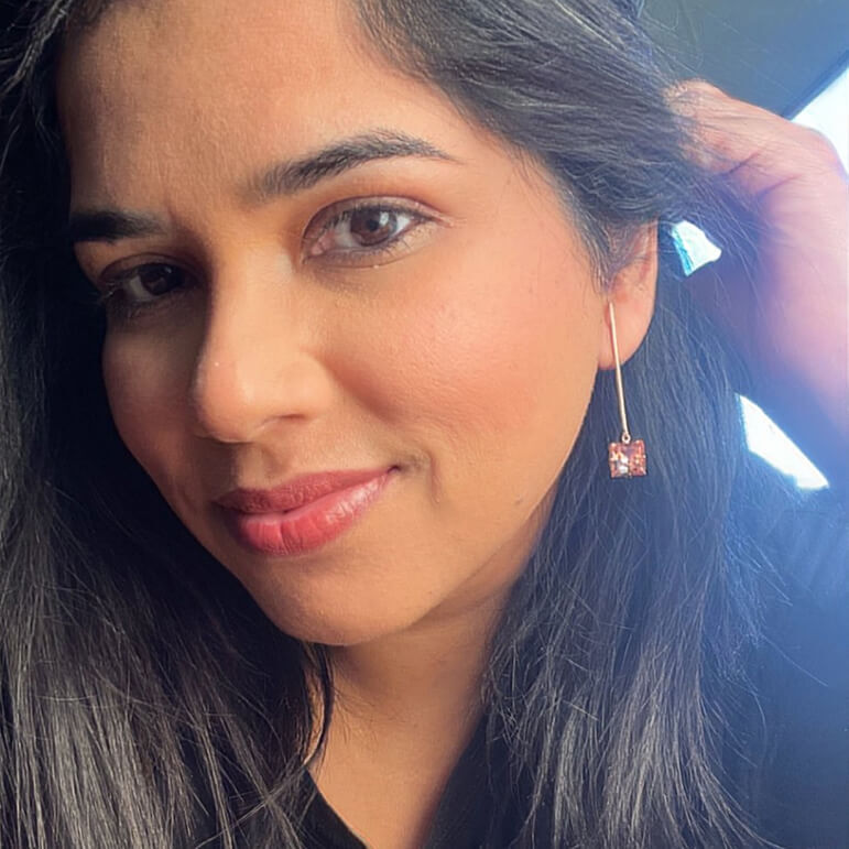 rose gold dangle earrings with light rose Swarovski on model