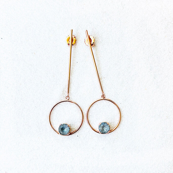 rose gold dangle earrings with grey Swarovski top view