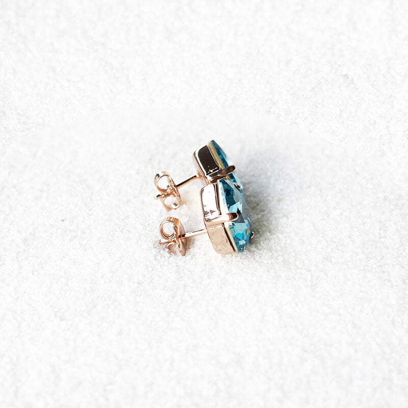Aquamarine stud earrings with a blue swarovski set in rose gold - stud closures