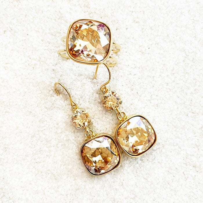 swarovski gold ring and gold dangle earrings