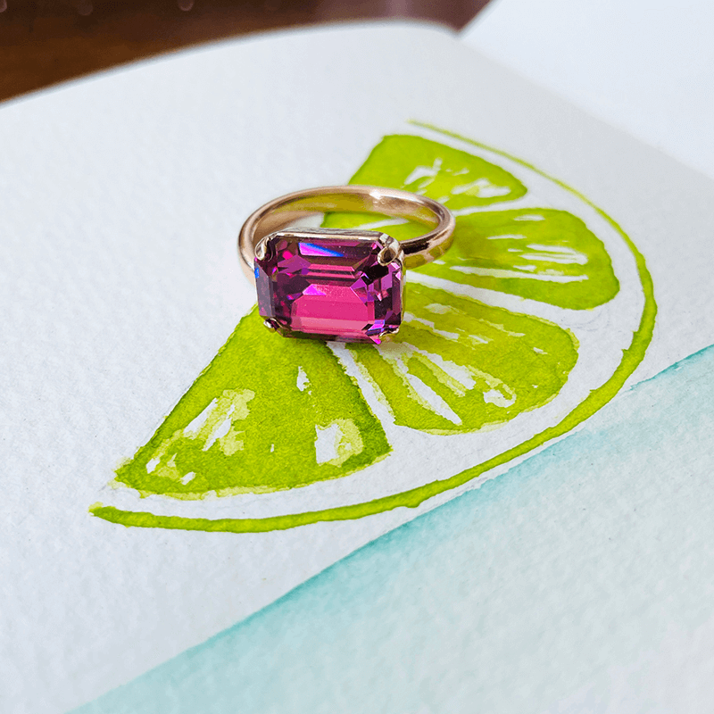 Swarovski pink ring, adjustable ring. against a colour pop background