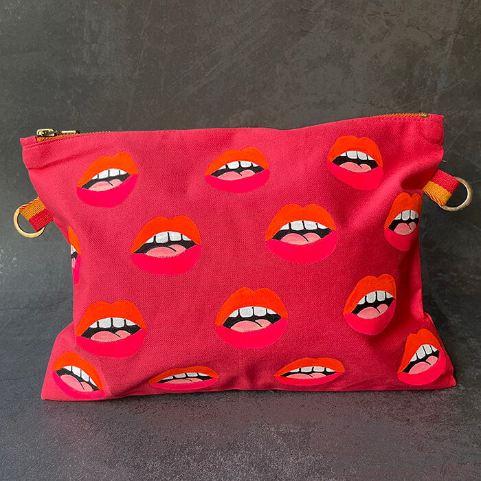 pink hand painted bag with lots of lips 