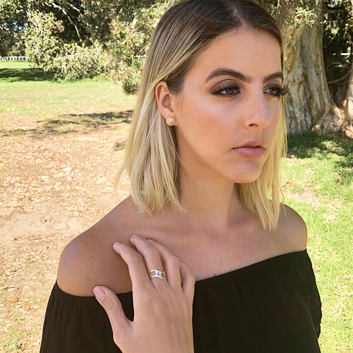 flat rose gold adjustable ring with star shaped cutouts on model