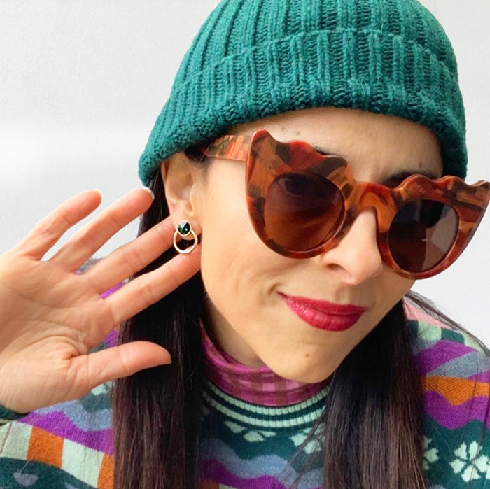 emerald green earrings on model