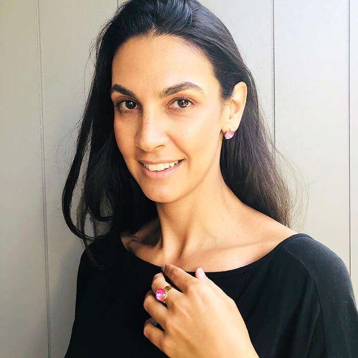 Pink Crystal Stud Earrings set in gold plating on model