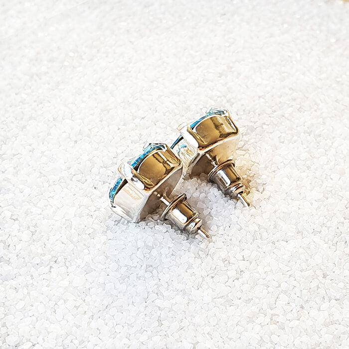 swarovksi stud earrings in rhodium silver with aquamarine swarovski crystal back of earring
