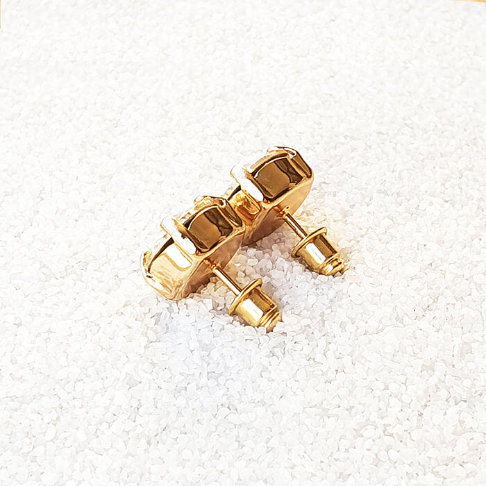 swarovksi stud earrings in 24k gold plating with gold swarovski crystal side back