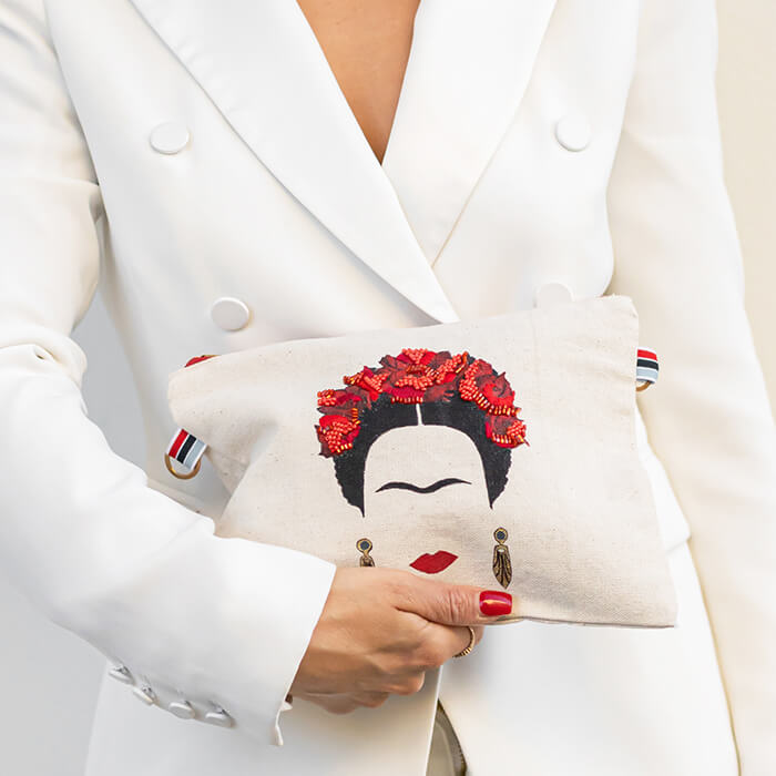 hand embroidered quirky designer bag with Frida Kahlo on model
