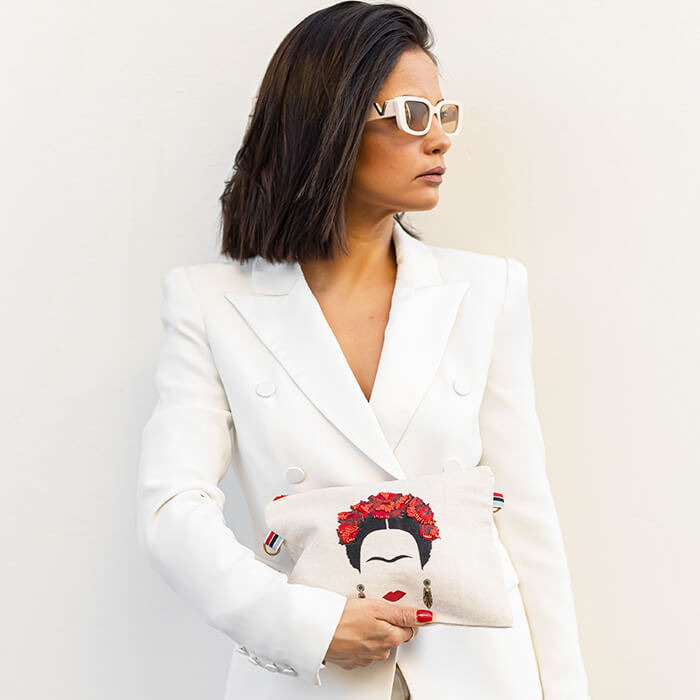 hand embroidered quirky designer bag with Frida Kahlo on model