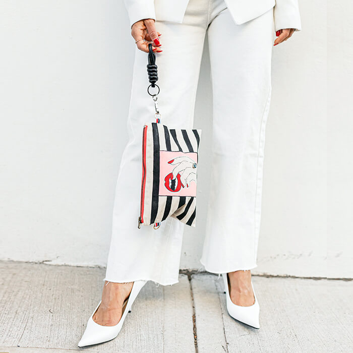 Hand painted Canvas Bag with fingers wearing a swarovski crystal biting teeth hanging 