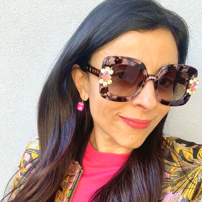 hot pink crystal earrings on model