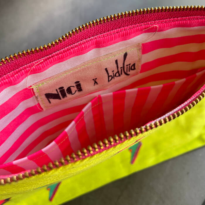 Neon Clutch bag with hand painted fluoro lightening bolts with fluoro pink and white stripped lining