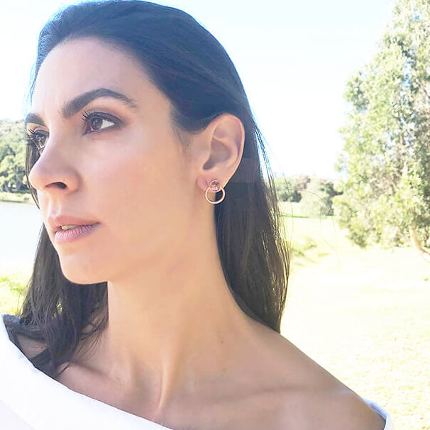 rose gold stud earrings with blush rose swarovski set in rose gold on model