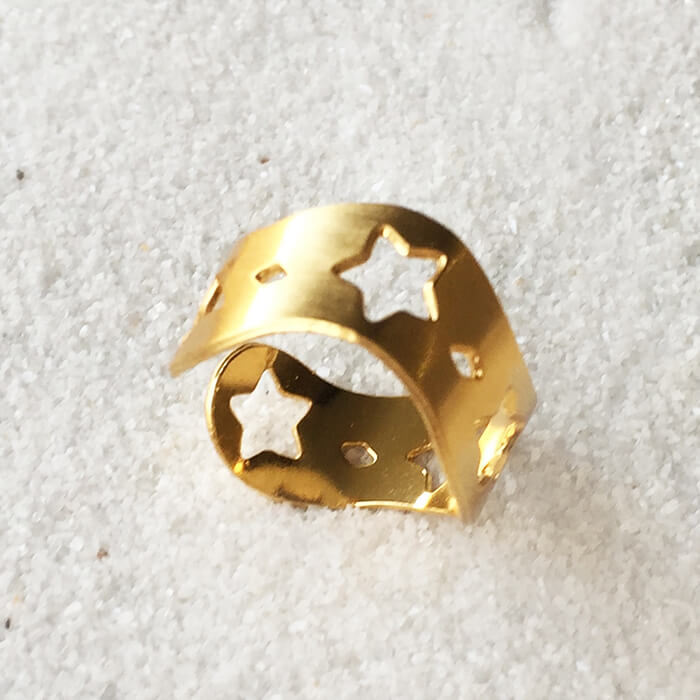 elegant adjustable ring in gold with star cutouts