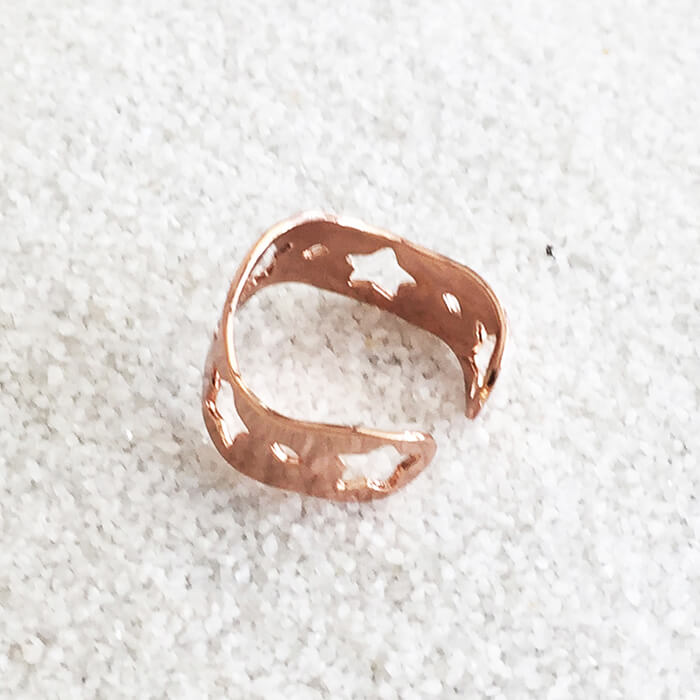 flat rose gold adjustable ring with star shaped cutouts 