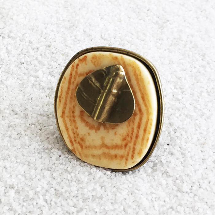 large statement ring with marbled resin and a super imposed gold leaf