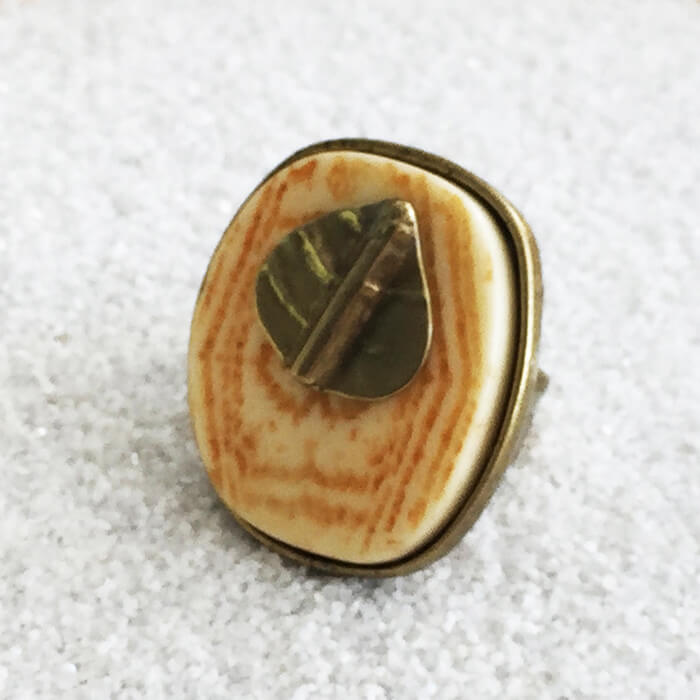 large statement ring with marbled resin and a super imposed antique gold leaf