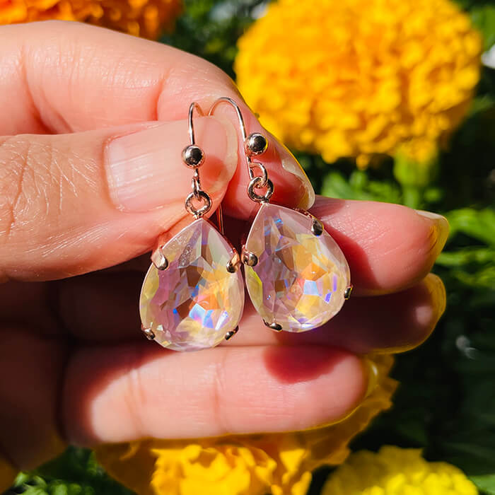 Swarovski Pink Drop Earrings against flowers 