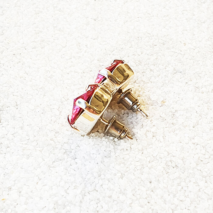 swarovksi stud earrings in silver with bright pink swarovski crystal back